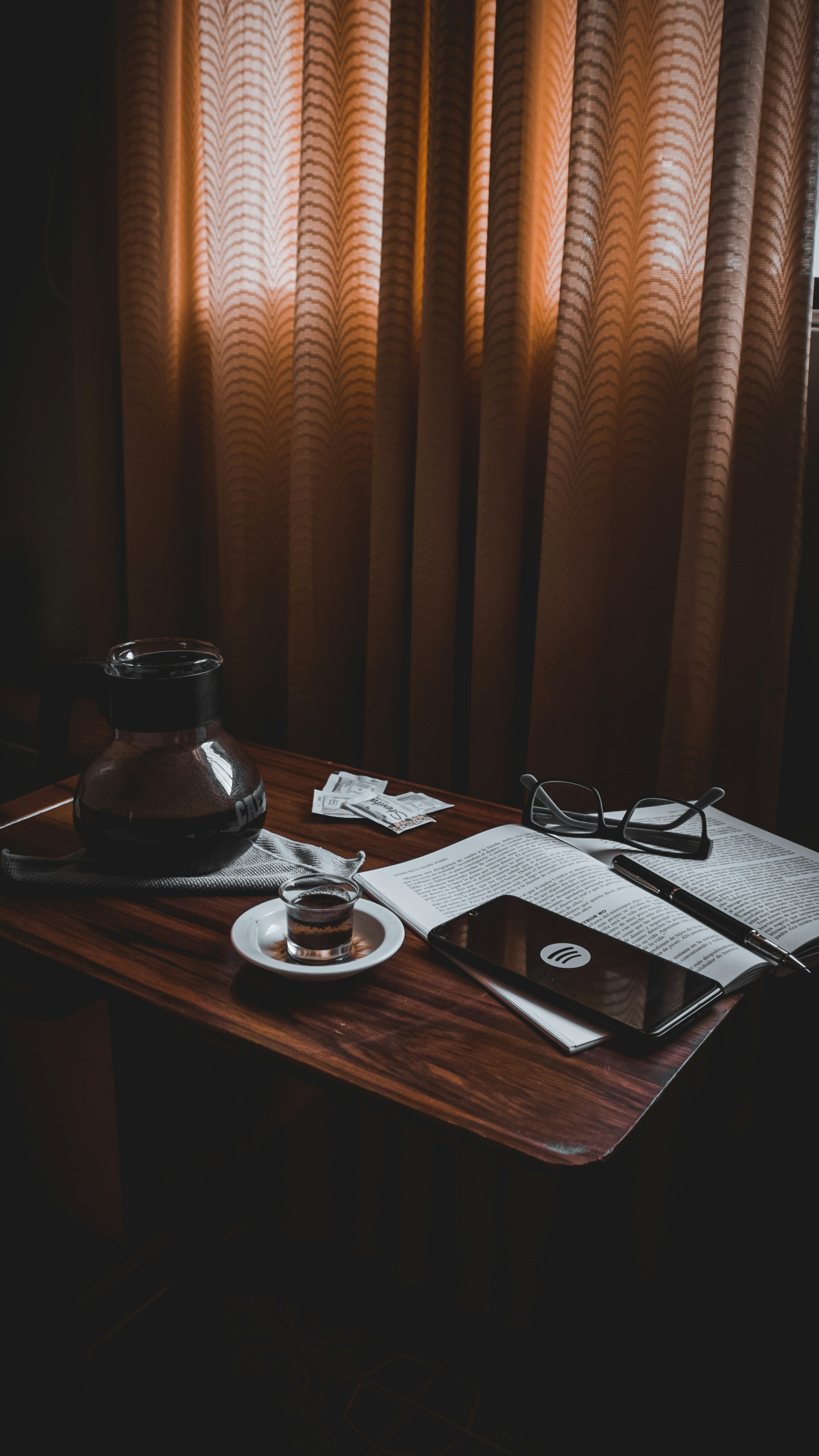 black framed eyeglasses on white ceramic plate